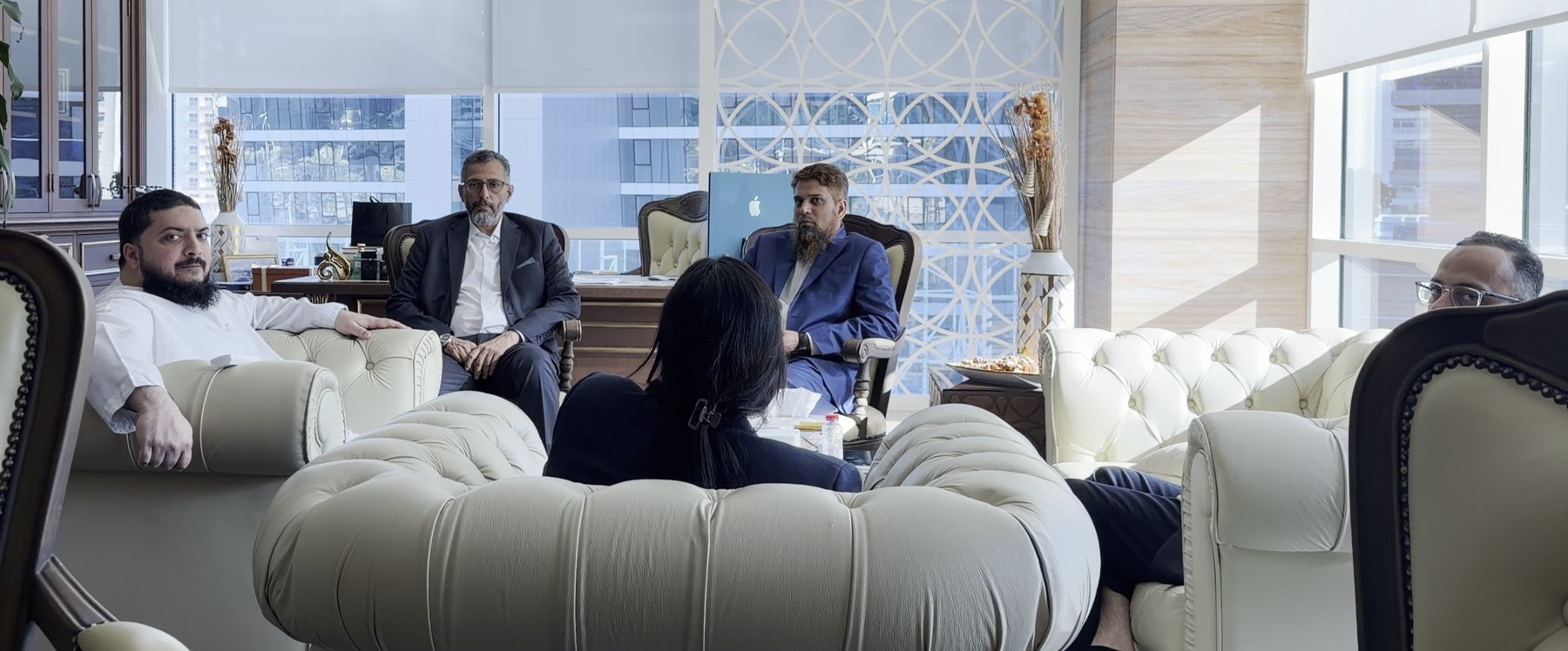 Afzal in a working session with his team